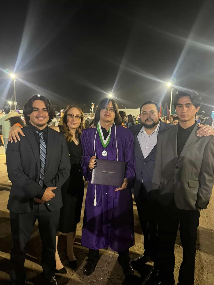Cruz with his family celebrating a Bioscience High School graduation