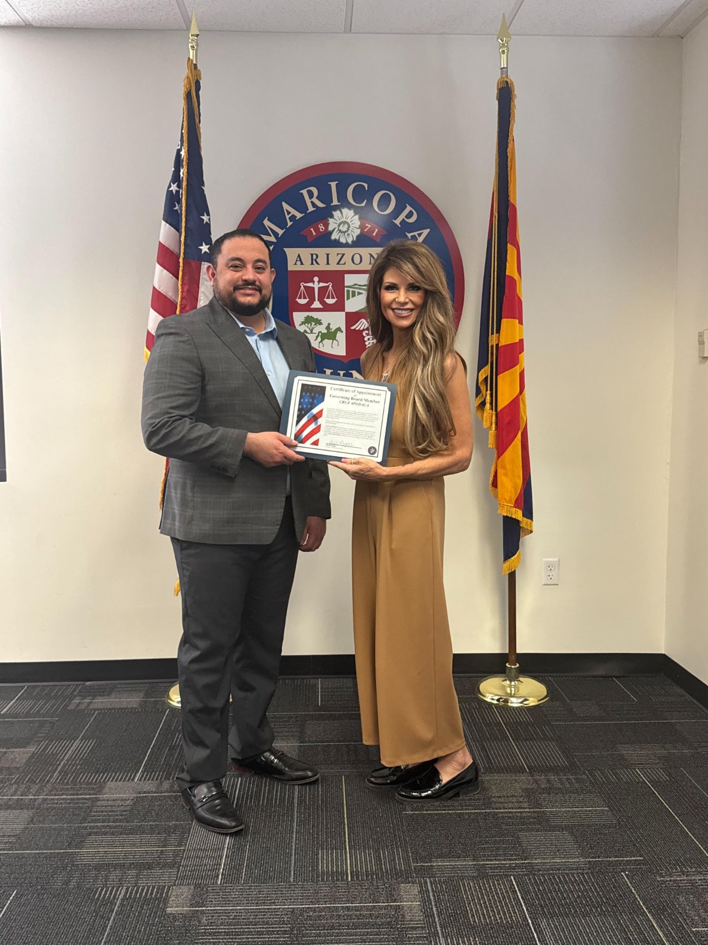 Cruz Apodaca receiving Certificate of Appointment as Governing Board Member